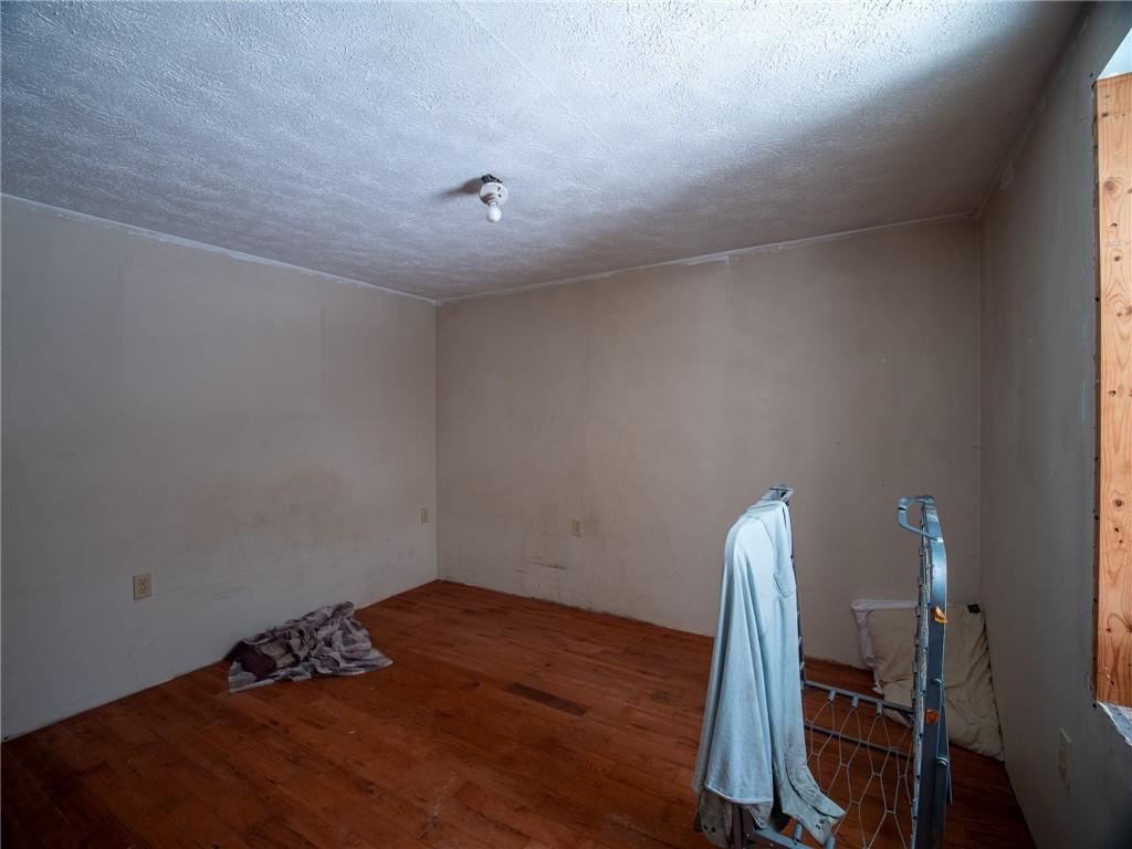 1276 Glades Pike Somerset, PA 15501 - Photo 30 of 32 a view of a room with wooden floor and bedroom