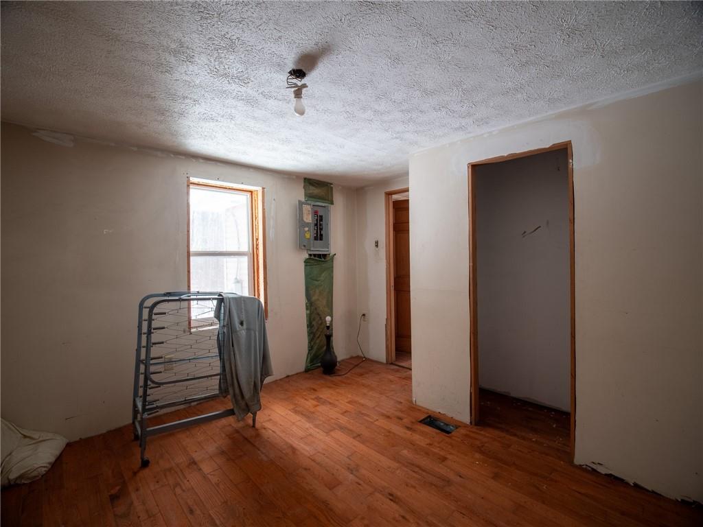 1276 Glades Pike Somerset, PA 15501 - Photo 31 of 32 an empty room with wooden floor and windows