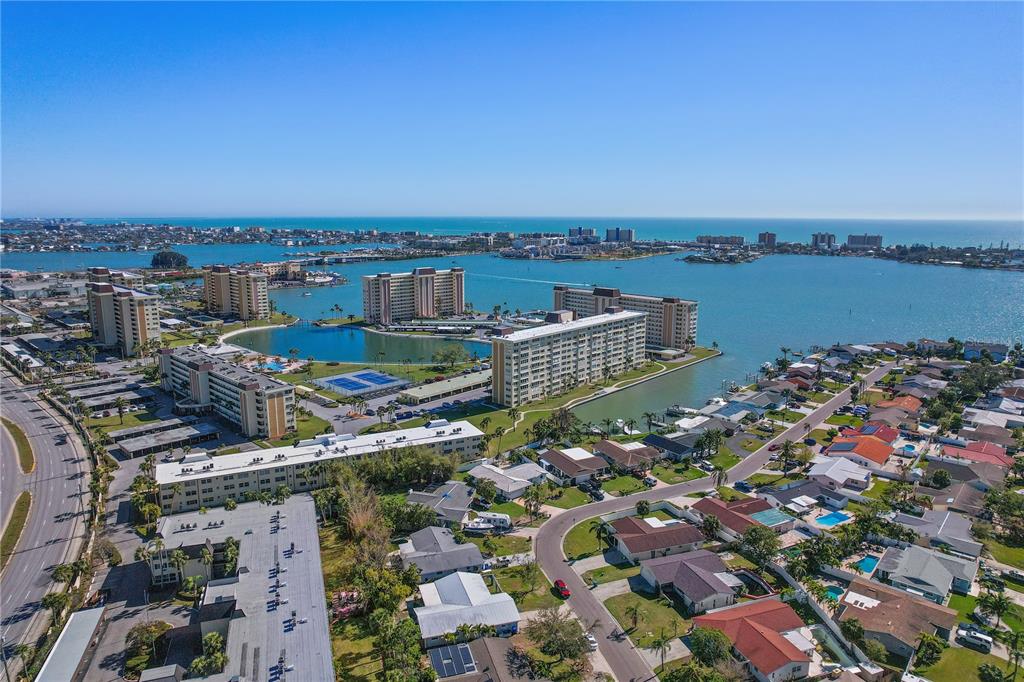 4650 Cove Circle, Unit 611 St. Petersburg, FL 33708 - Photo 17 of 25 an aerial view of a city with lawn chairs