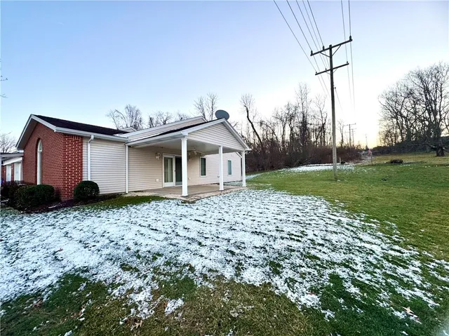 a house view with a backyard space