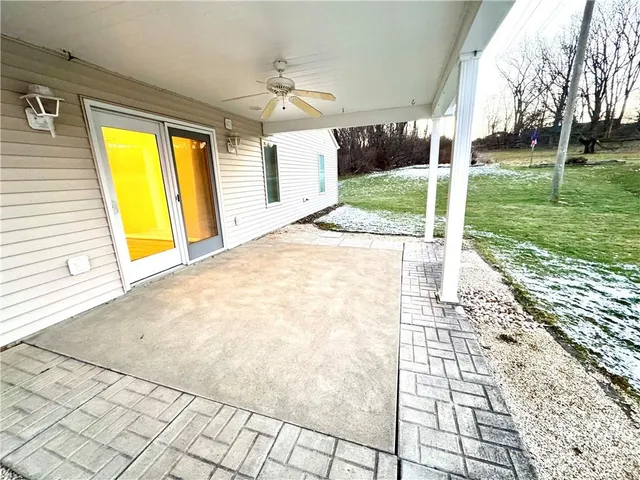 a view of a house with backyard and porch