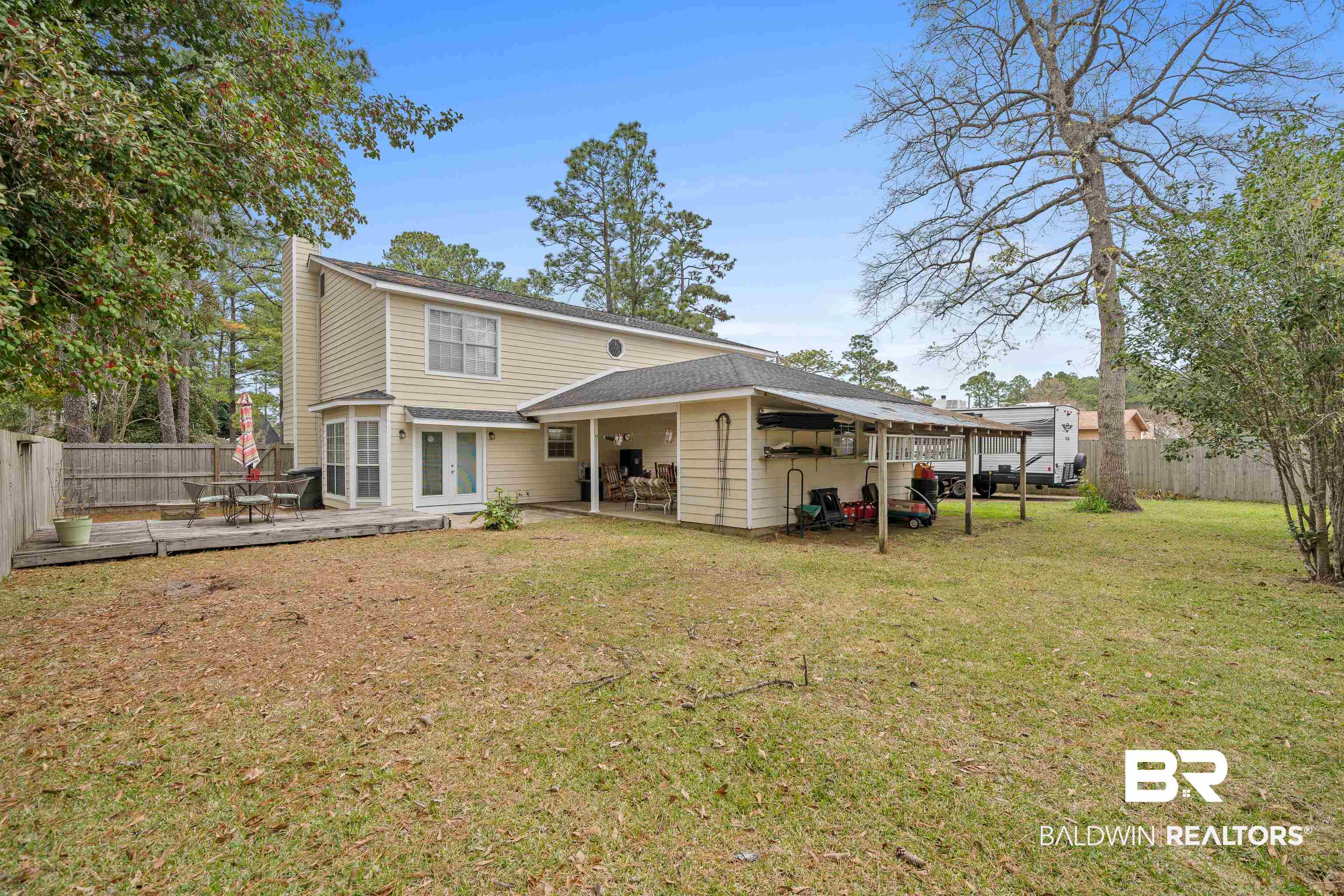 460 Ridgewood Drive Daphne, AL 36526 - Photo 27 of 31 Rear view of house featuring a yard