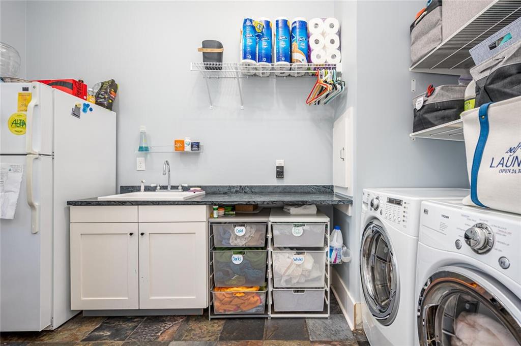 123 Ansley Street Decatur, GA 30030 - Photo 30 of 61 a utility room with sink dryer and washer