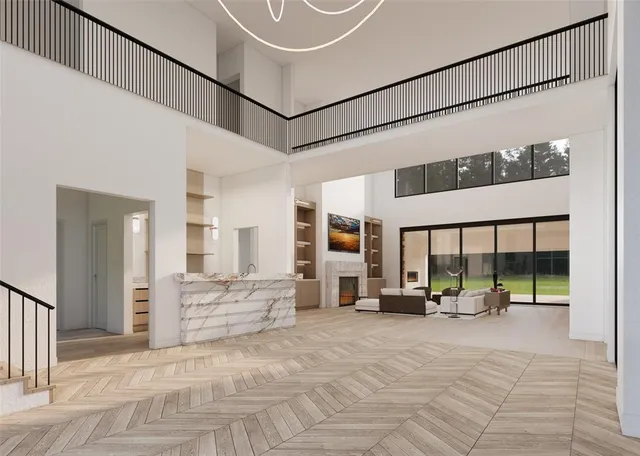 a lobby with furniture and floor to ceiling window