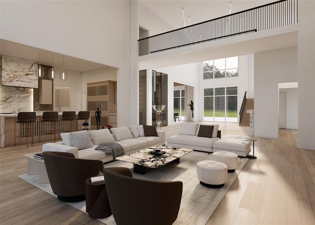a living room with furniture a fireplace and a floor to ceiling window