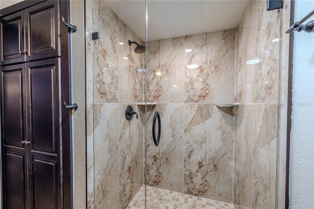 345 Boca Ciega Point Boulevard St. Petersburg, FL 33708 - Photo 15 of 64 a bathroom with a shower