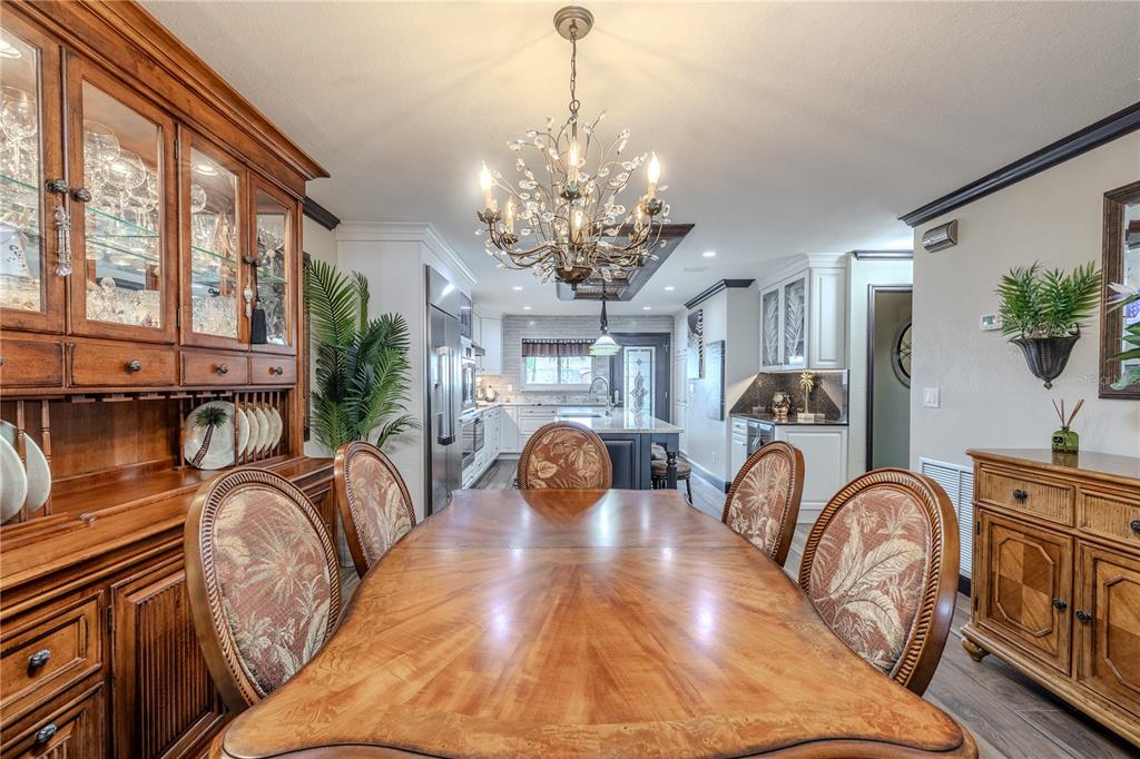345 Boca Ciega Point Boulevard St. Petersburg, FL 33708 - Photo 16 of 64 a view of a livingroom with furniture window kitchen chandelier