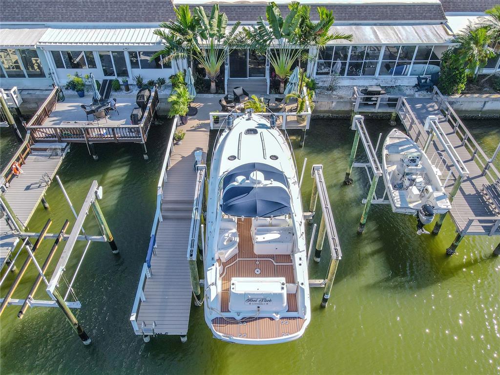 345 Boca Ciega Point Boulevard St. Petersburg, FL 33708 - Photo 2 of 64 a view of a swimming pool with a patio