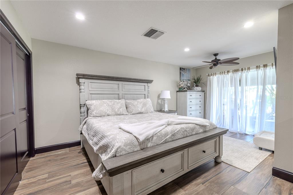 345 Boca Ciega Point Boulevard St. Petersburg, FL 33708 - Photo 21 of 64 a bedroom with a bed and a window