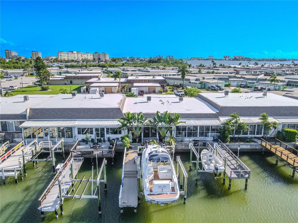 345 Boca Ciega Point Boulevard St. Petersburg, FL 33708 - Photo 42 of 64 an aerial view of a swimming pool and outdoor space