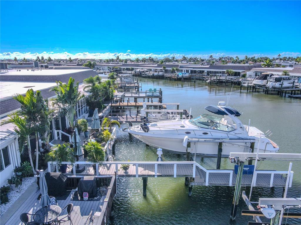 345 Boca Ciega Point Boulevard St. Petersburg, FL 33708 - Photo 43 of 64 a view of a lake with a terrace