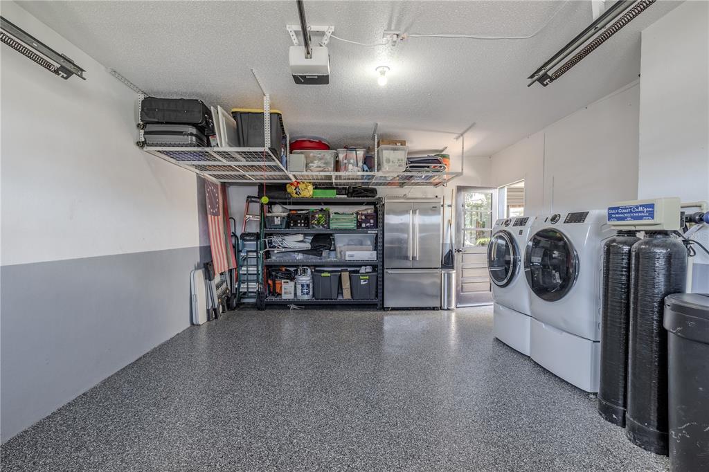 345 Boca Ciega Point Boulevard St. Petersburg, FL 33708 - Photo 45 of 64 a view of a storage and utility area with racks