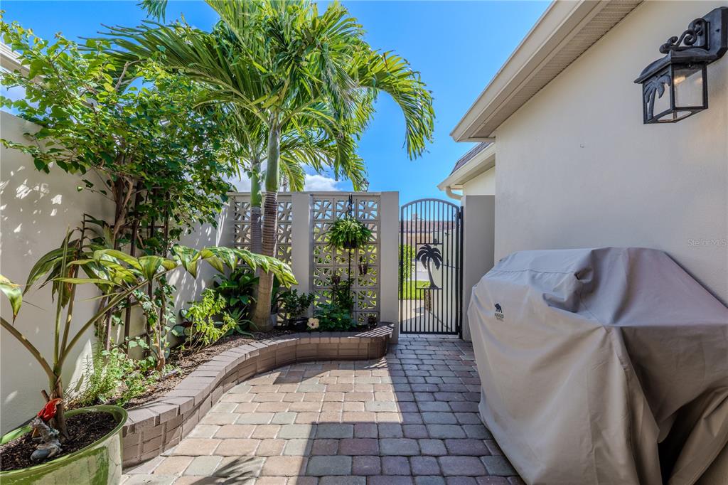 345 Boca Ciega Point Boulevard St. Petersburg, FL 33708 - Photo 47 of 64 a view of a porch with chairs and potted plants