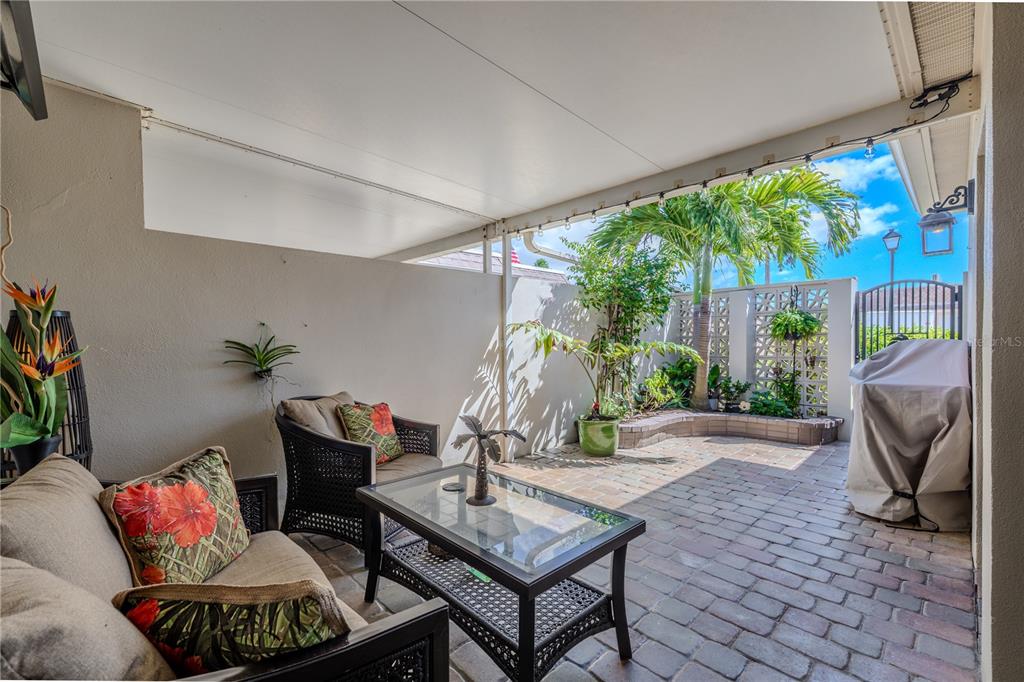 345 Boca Ciega Point Boulevard St. Petersburg, FL 33708 - Photo 49 of 64 a living room with furniture and a floor to ceiling window