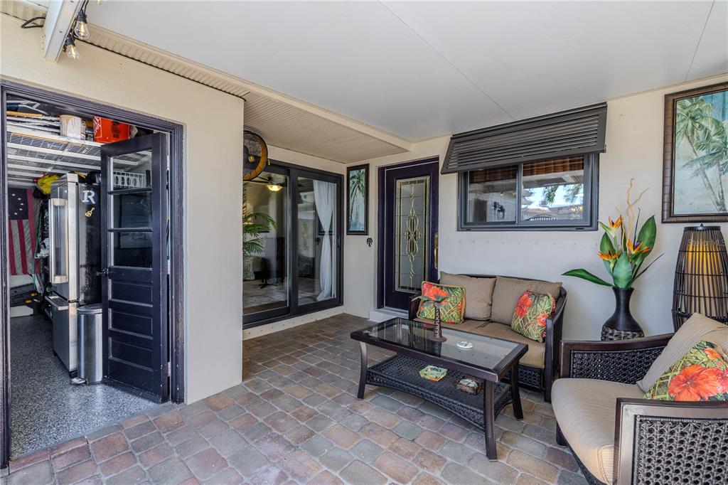 345 Boca Ciega Point Boulevard St. Petersburg, FL 33708 - Photo 50 of 64 a living room with furniture and a potted plant