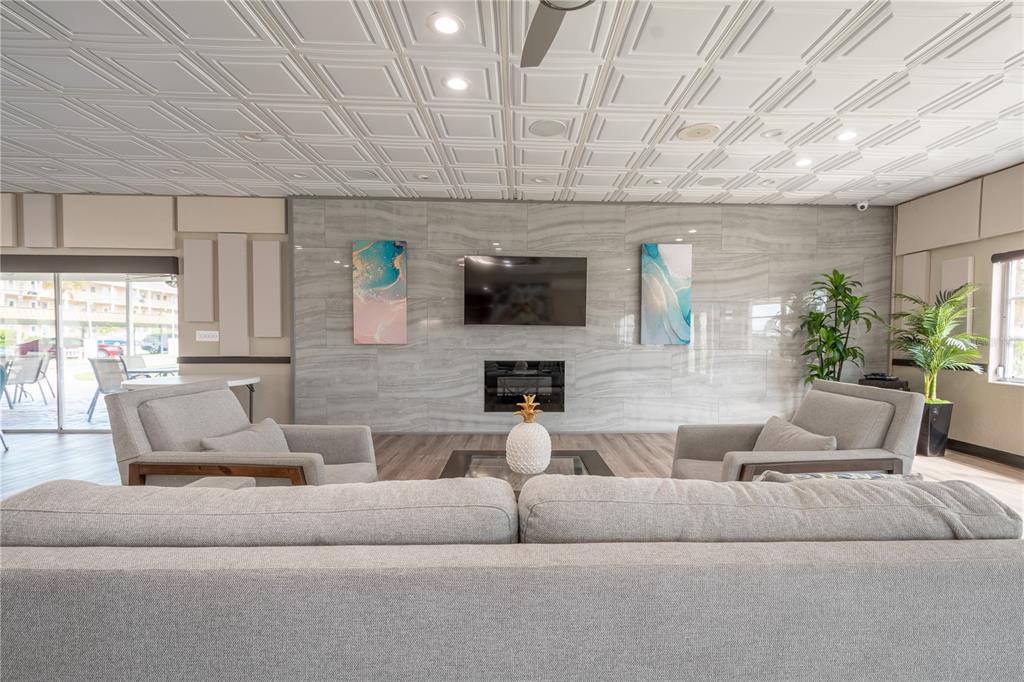 345 Boca Ciega Point Boulevard St. Petersburg, FL 33708 - Photo 58 of 64 a living room with furniture and a flat screen tv