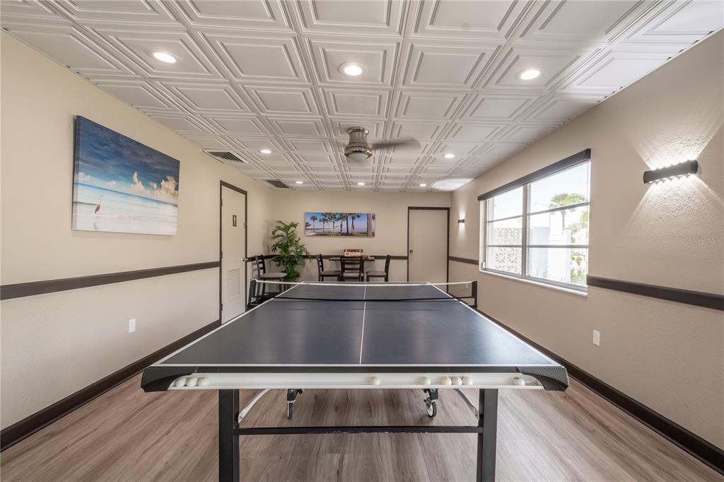 345 Boca Ciega Point Boulevard St. Petersburg, FL 33708 - Photo 62 of 64 a view of a kitchen with stainless steel appliances granite countertop a refrigerator a sink dishwasher a stove and white countertops with wooden floor