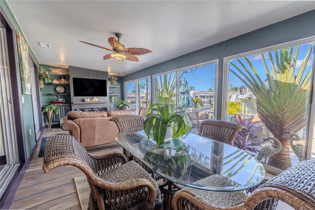 345 Boca Ciega Point Boulevard St. Petersburg, FL 33708 - Photo 7 of 64 a living room with furniture or chandelier and a flat screen tv