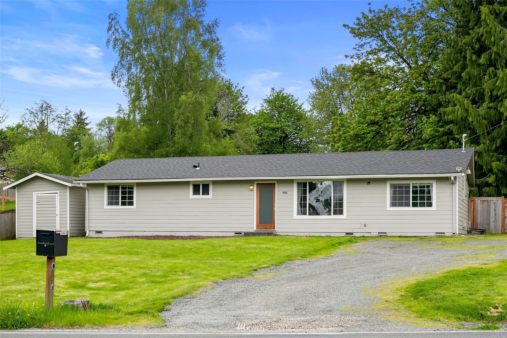 14416 Connelly Road Snohomish, WA 98296 - Photo 1 of 24 a front view of a house with a garden