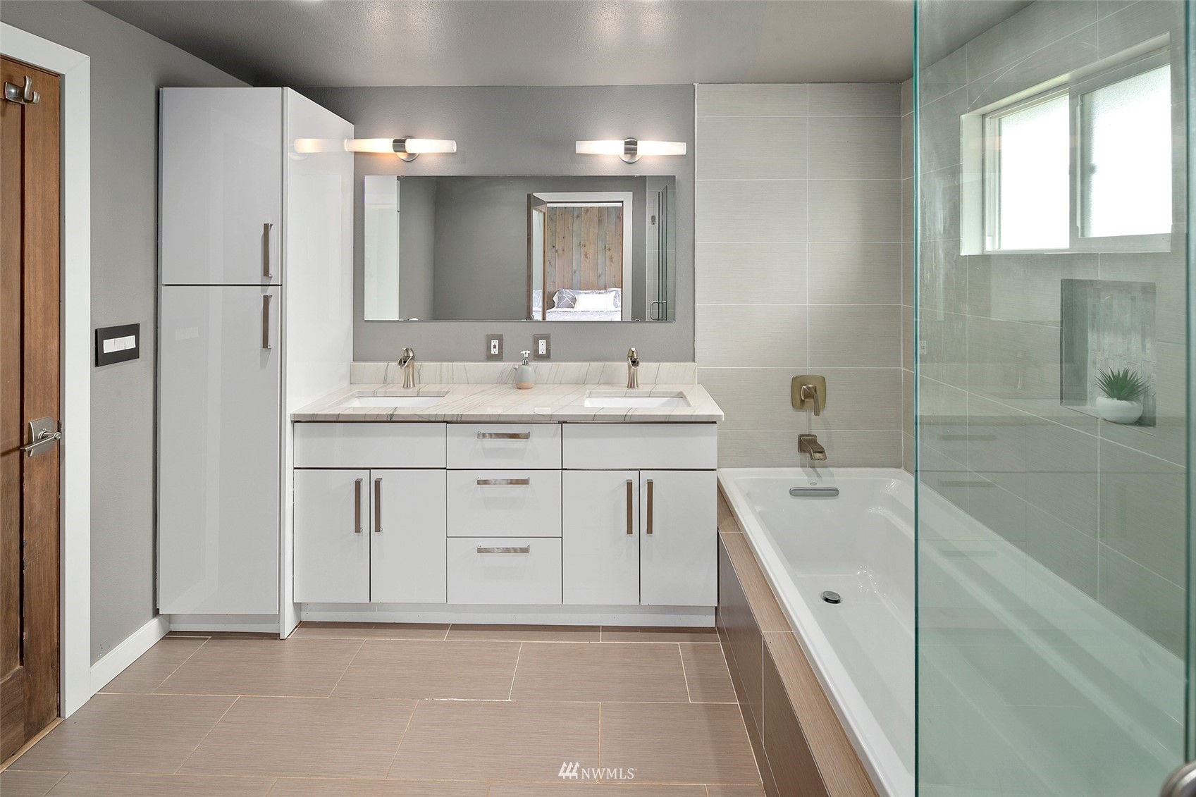 14416 Connelly Road Snohomish, WA 98296 - Photo 14 of 24 a spacious bathroom with a double vanity sink a mirror and a bathtub