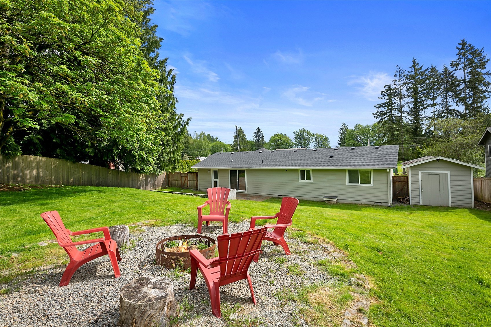 14416 Connelly Road Snohomish, WA 98296 - Photo 20 of 24 a view of a house with a yard and sitting area