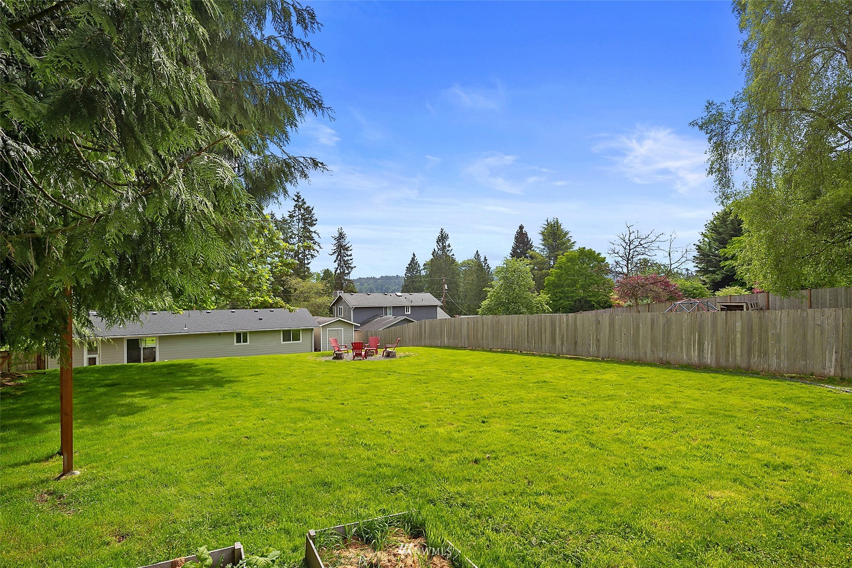 14416 Connelly Road Snohomish, WA 98296 - Photo 21 of 24 a view of a backyard with plants and large trees