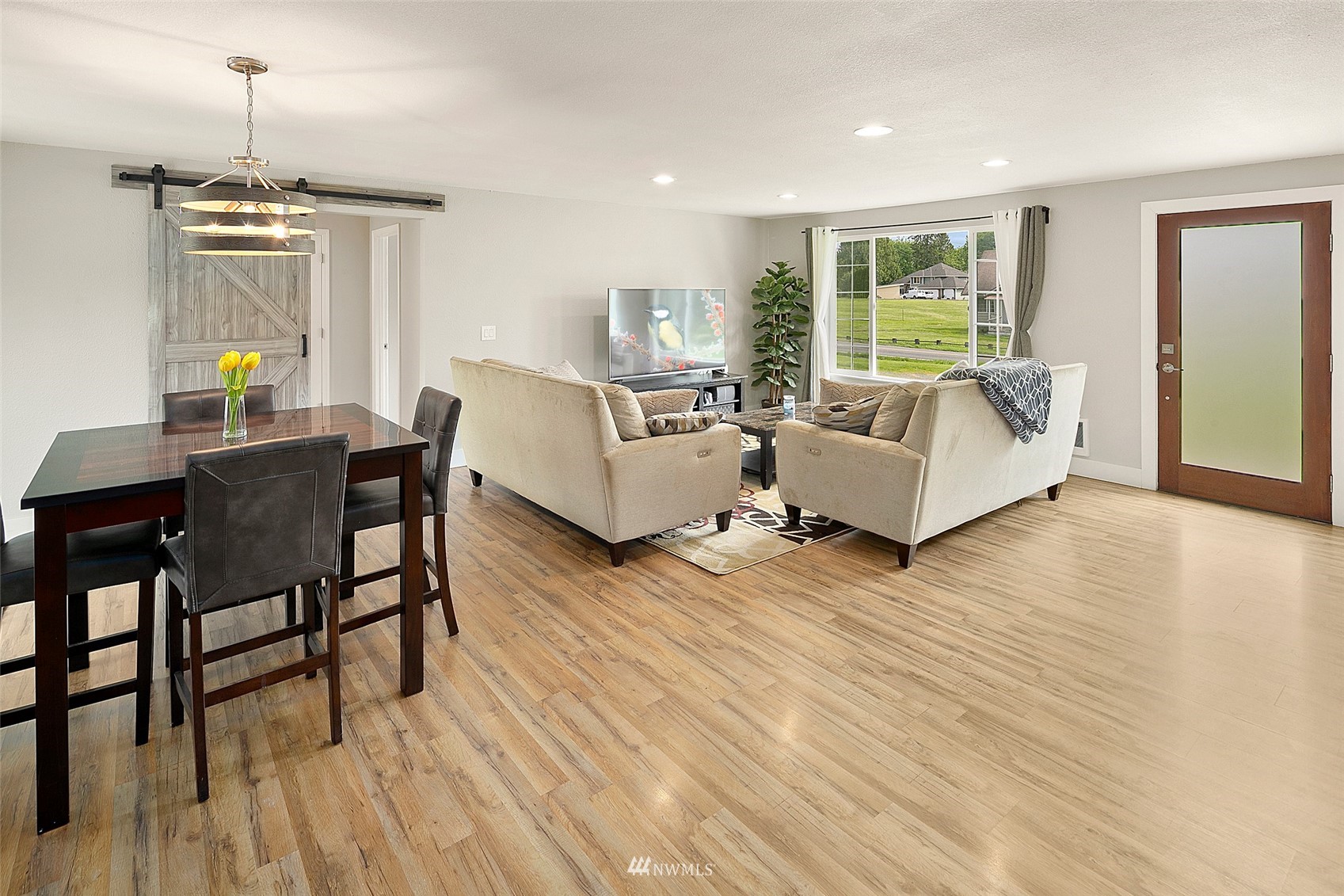 14416 Connelly Road Snohomish, WA 98296 - Photo 5 of 24 a living room with furniture and a wooden floor