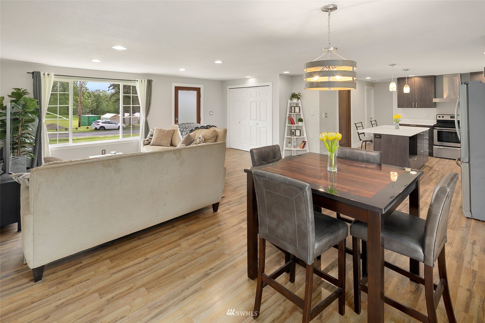 14416 Connelly Road Snohomish, WA 98296 - Photo 6 of 24 a kitchen with a table chairs refrigerator and microwave