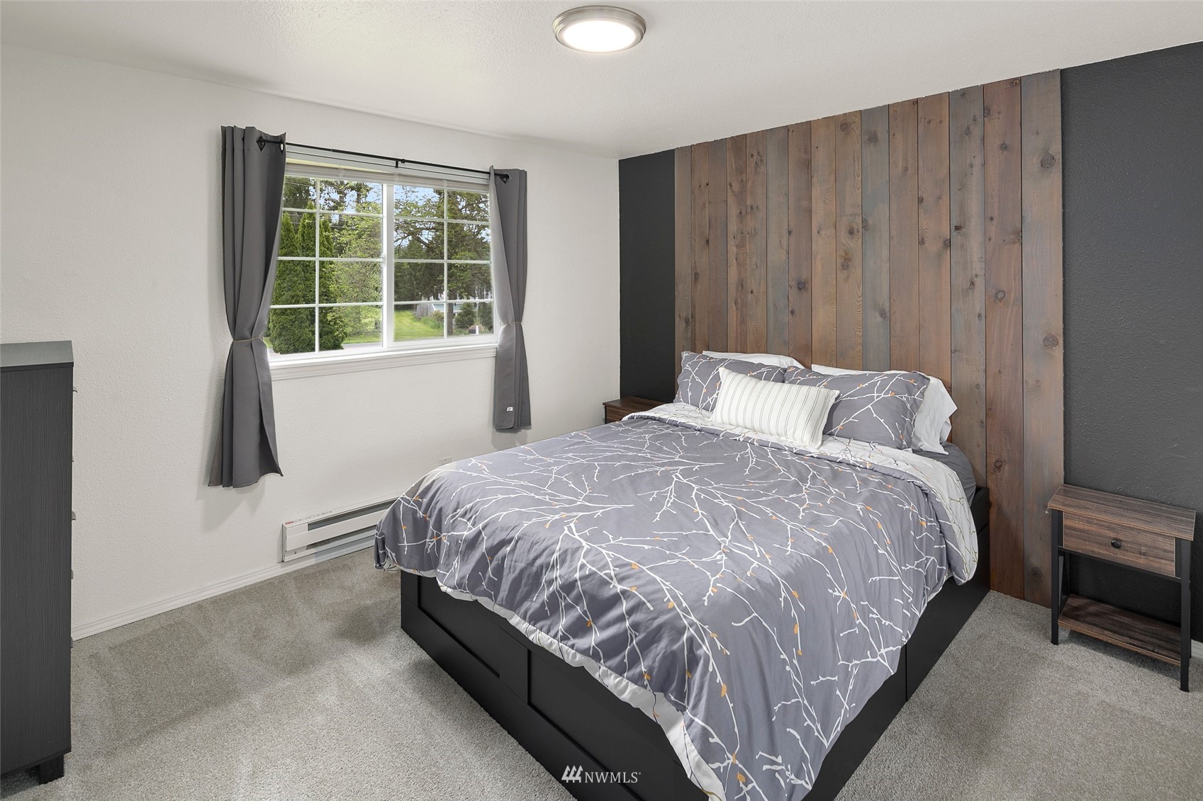 14416 Connelly Road Snohomish, WA 98296 - Photo 10 of 24 a large bed sitting in a bedroom next to a window