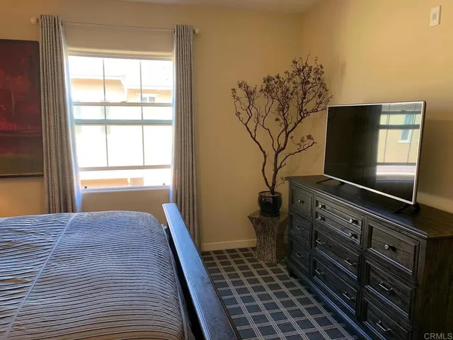 a kitchen with a sink and wooden floor