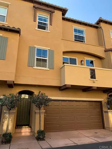 a front view of a house with parking