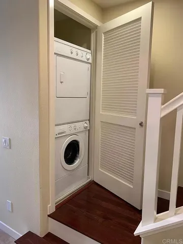 a view of a storage and utility room with washer and dryer