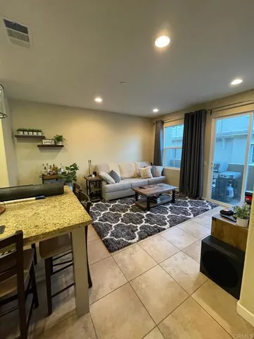 a kitchen with stainless steel appliances kitchen island granite countertop a sink and cabinets