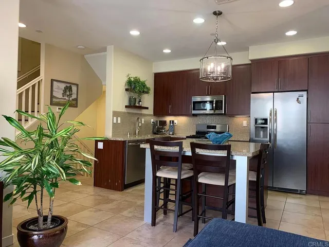 a kitchen with counter space cabinets and appliances