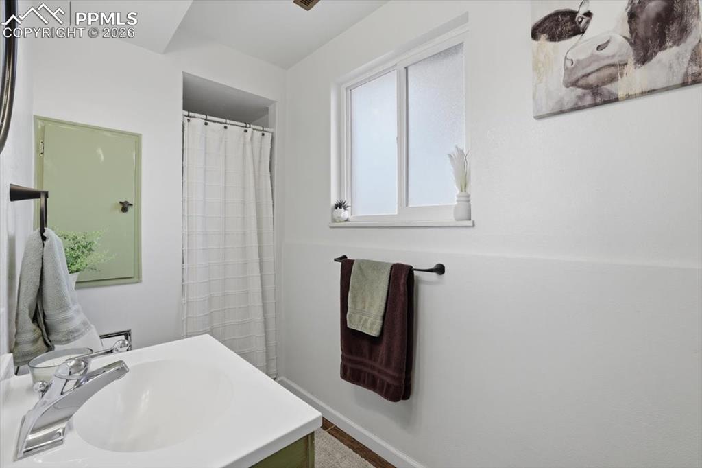 2918 Flintridge Square Colorado Springs, CO 80918 - Photo 37 of 49 a bathroom with a sink and a mirror