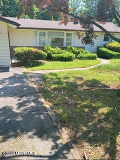 11 1/2 Edgewater Drive Matawan, NJ 07747 - Photo 1 of 1 a front view of a house with a yard