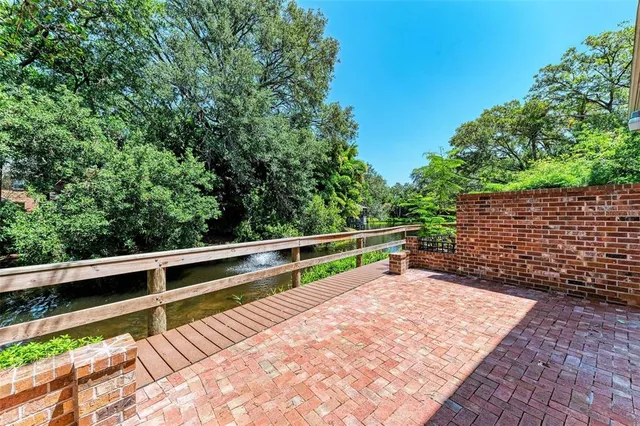 a view of sitting area with large trees
