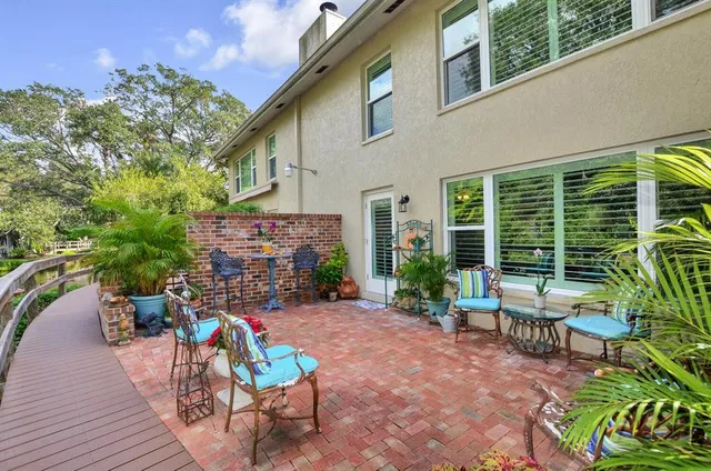 a view of a chairs and table in a patio