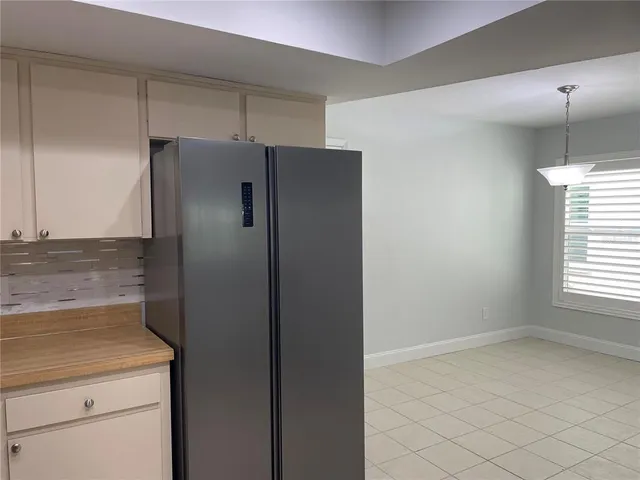 a bathroom with a shower and a sink