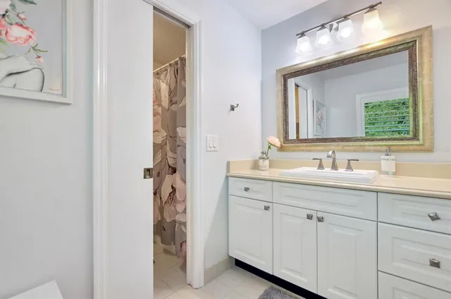 a bathroom with a double vanity sink and a mirror