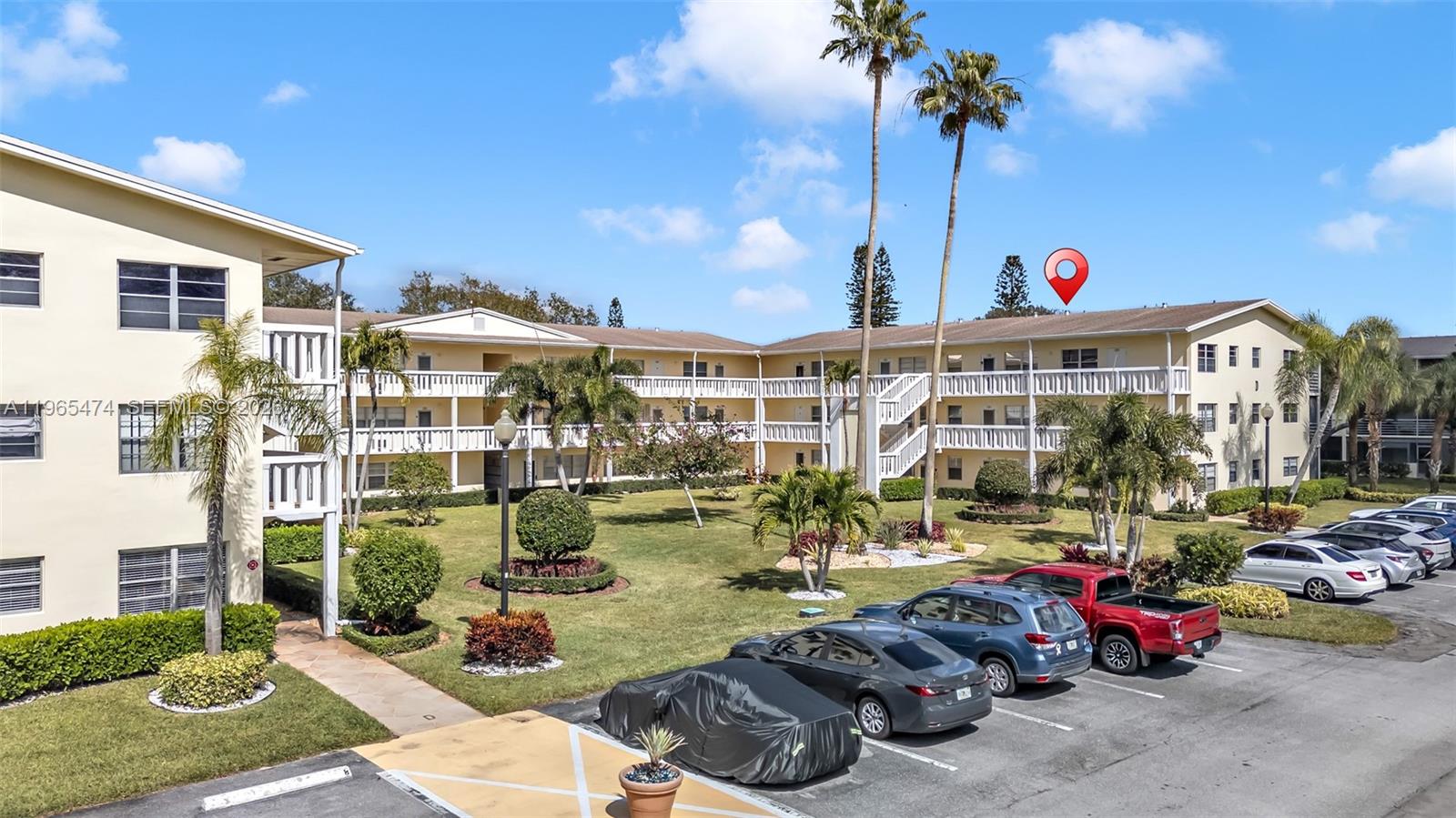 152 Dorset D, Unit 152 Boca Raton, FL 33434 - Photo 27 of 31 a view of a building with street view