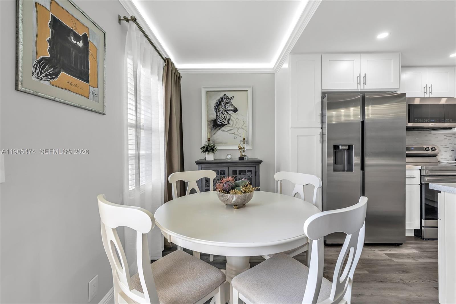 152 Dorset D, Unit 152 Boca Raton, FL 33434 - Photo 4 of 31 a dining room with furniture and window