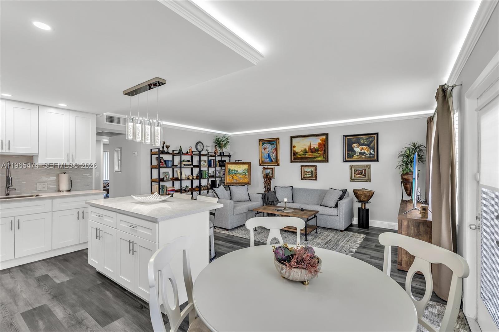 152 Dorset D, Unit 152 Boca Raton, FL 33434 - Photo 5 of 31 a kitchen with a sink stove and cabinets