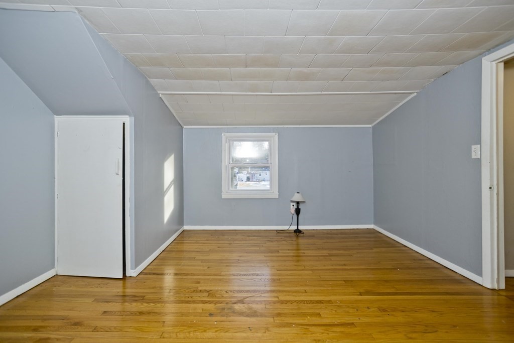 33 Campechi Street Springfield, MA 01104 - Photo 21 of 37 a view of empty room with window and wooden floor