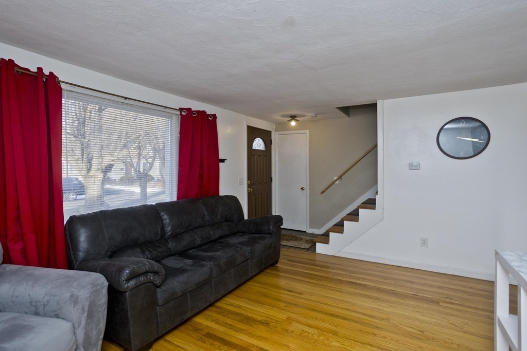 33 Campechi Street Springfield, MA 01104 - Photo 3 of 37 a living room with furniture and stairs