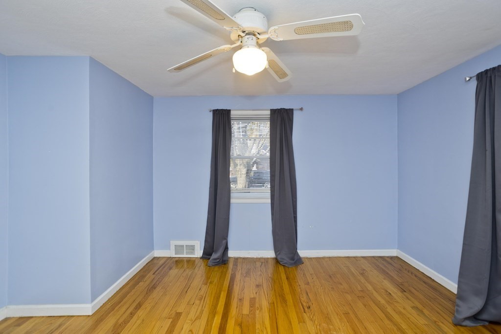 33 Campechi Street Springfield, MA 01104 - Photo 31 of 37 a view of room with window and wooden floor
