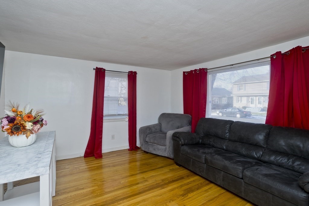33 Campechi Street Springfield, MA 01104 - Photo 6 of 37 a living room with furniture and wooden floor