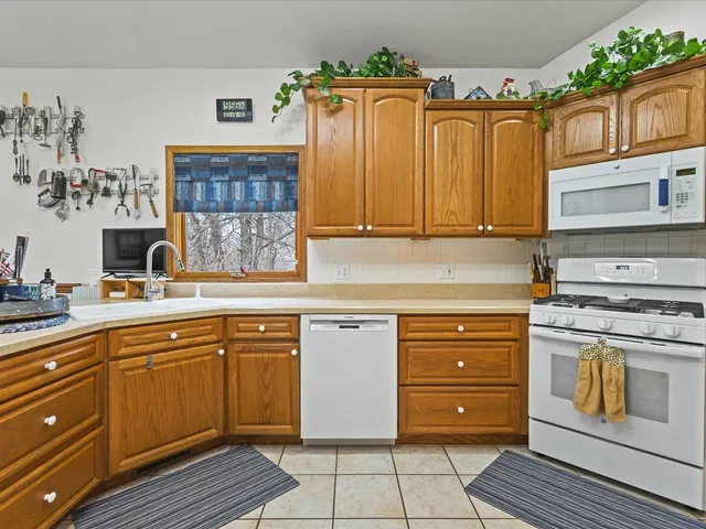 a kitchen with stainless steel appliances granite countertop a stove and a sink