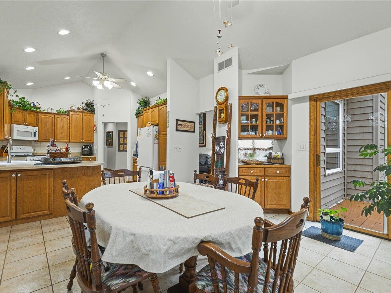625 Lake Summerset Road Lake Summerset, IL 61019 - Photo 13 of 51 a kitchen with stainless steel appliances kitchen island granite countertop a dining table chairs sink and white cabinets