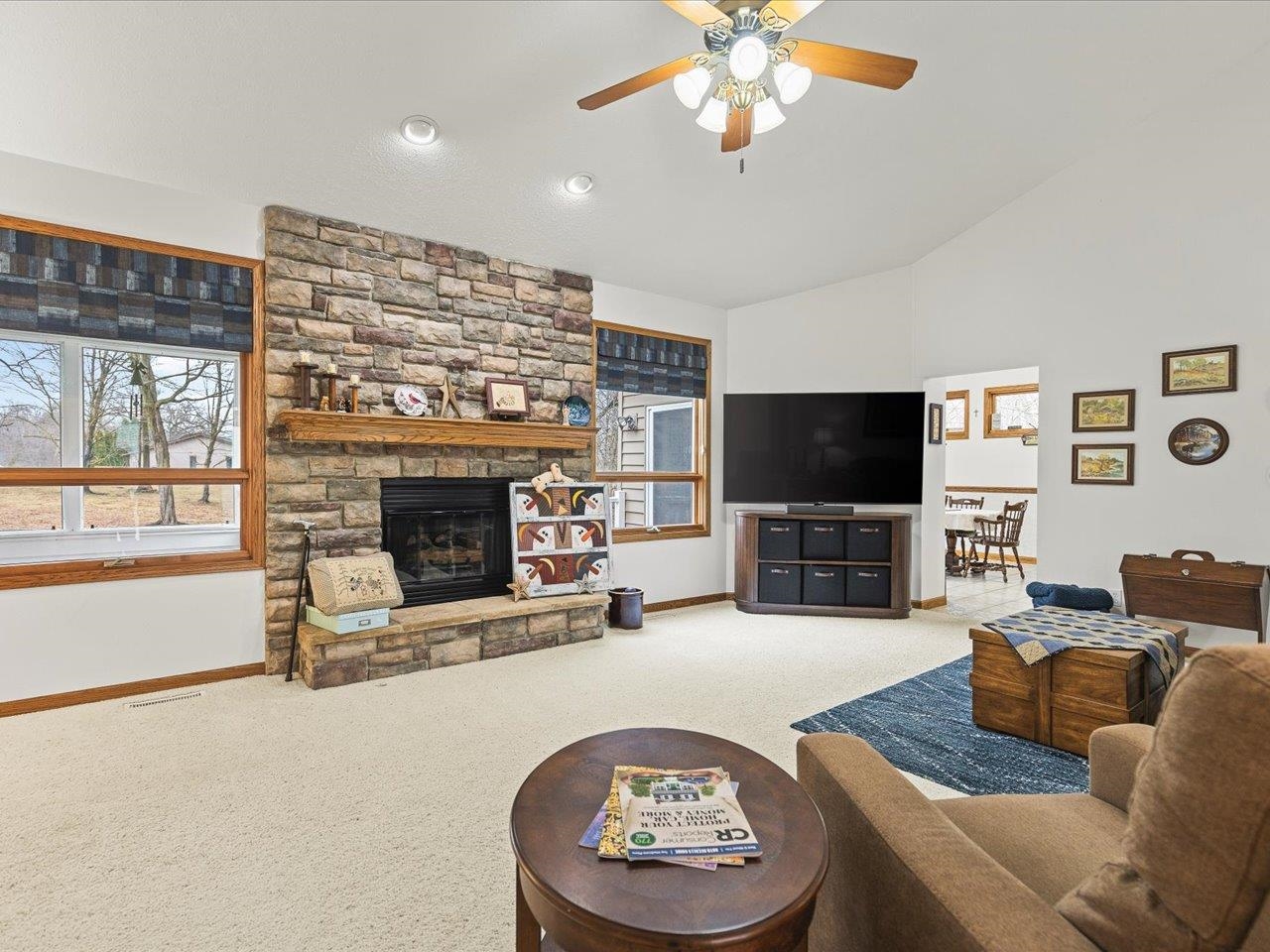 625 Lake Summerset Road Lake Summerset, IL 61019 - Photo 16 of 51 a living room with furniture a flat screen tv and a fireplace